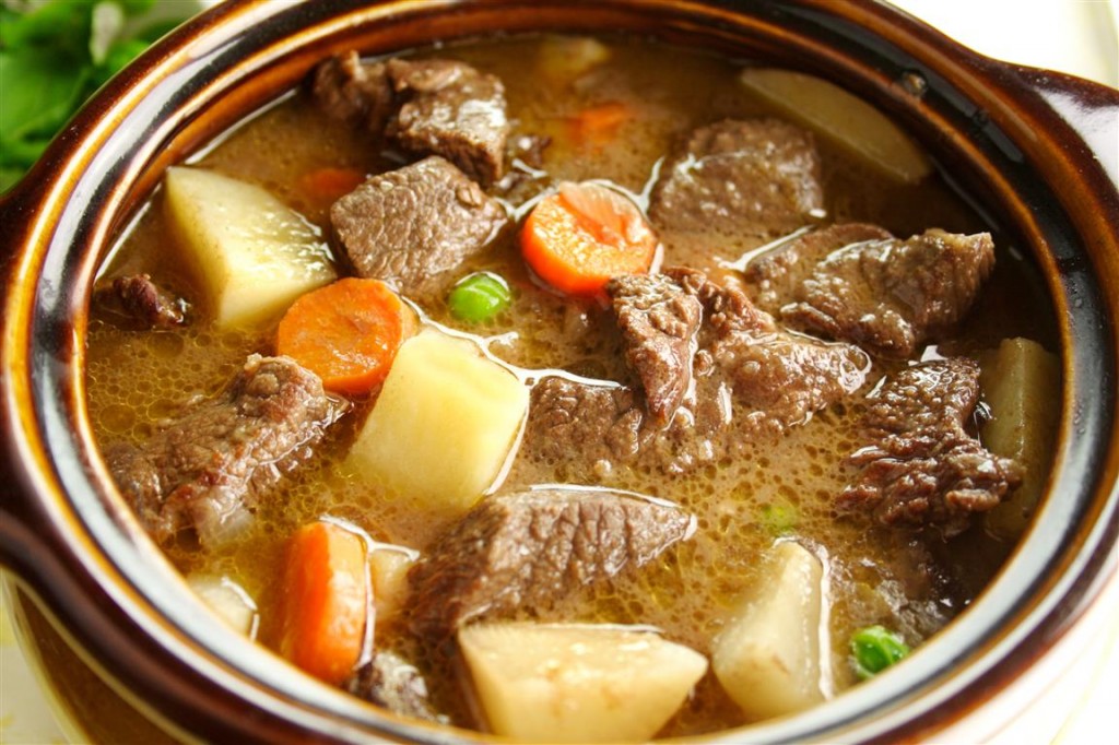 Rich hearty beef stew simmering and ready to serve.